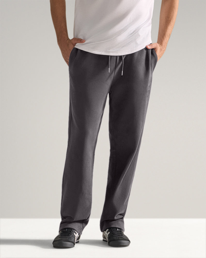 Dark-Charcoal | Front view of the Heavyweight Fleece Pant with hands in pockets and drawstring waist