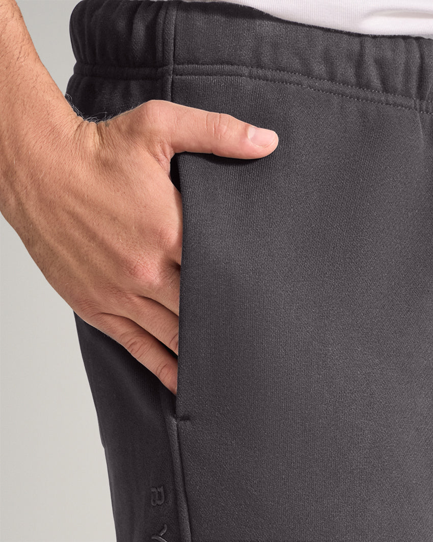 Dark-Charcoal | Close-up of the Heavyweight Fleece Pant side pocket and tonal embroidery