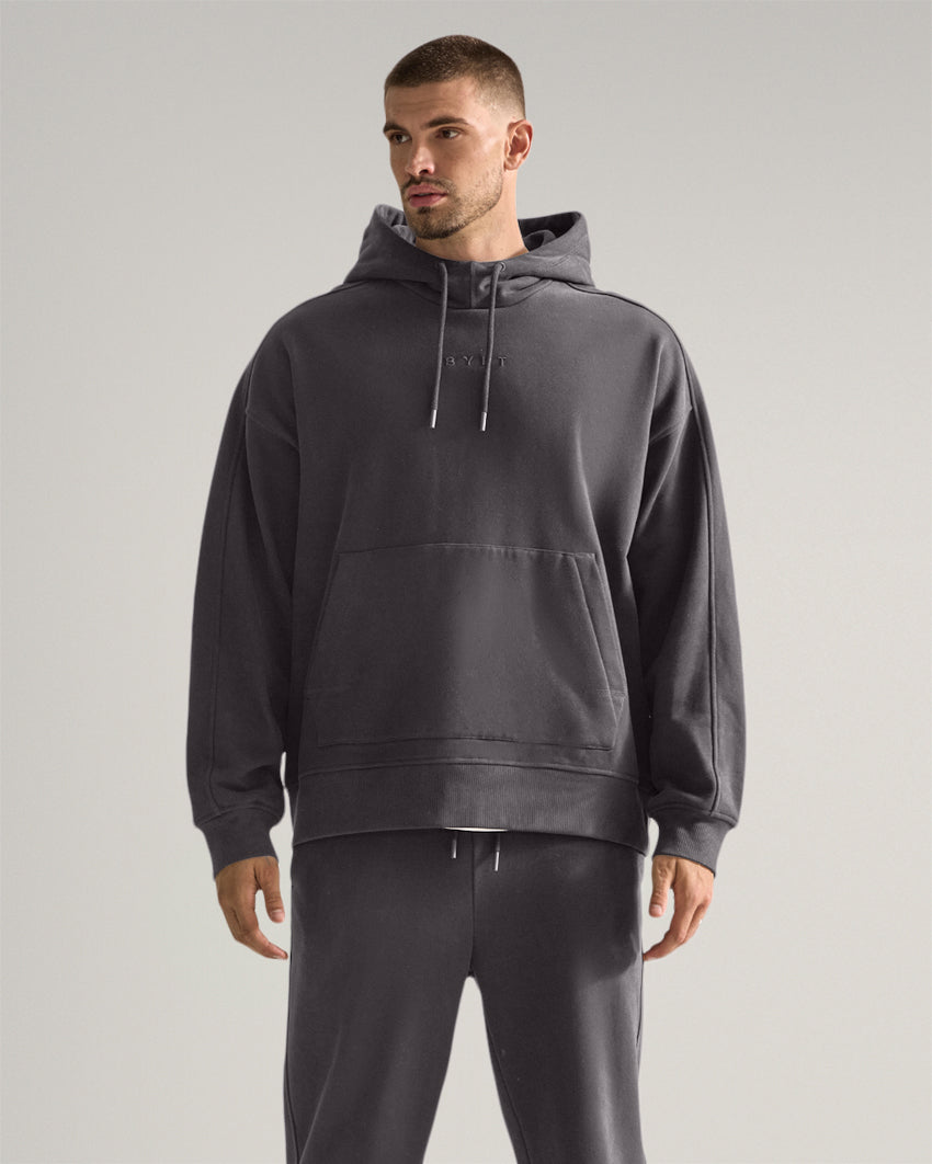 Dark-Charcoal | Front view of the Heavyweight Fleece Hoodie showing relaxed fit and kangaroo pocket